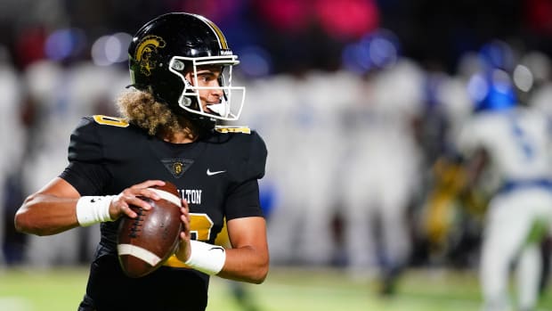 Oct 20, 2023; Carrollton, GA, USA; Carrollton Trojans quarterback Julian Lewis (10) drops back to pass against the Westlake Lions during the first half at Grisham Stadium. The 15-year-old Carrollton High student has already committed to playing for the University of Southern California Trojans and has been considered one of the top high school quarterback prospects. Mandatory Credit: John David Mercer-USA TODAY Sports